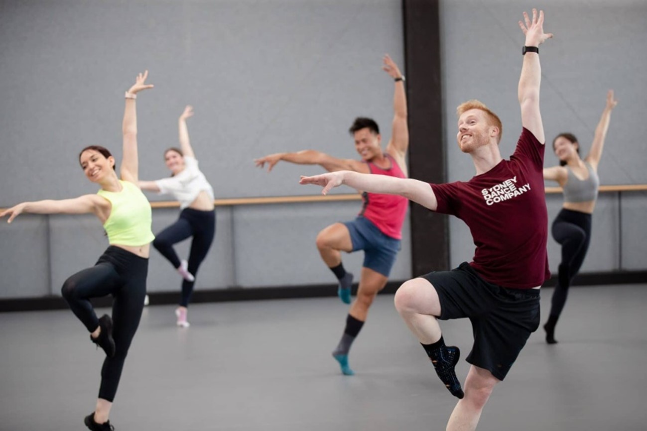 A photo of the Sydney Dance Company crew practicing