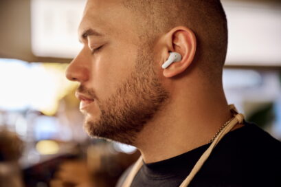 A man listening to music with the comfortable, ergonomically-designed TONE Free T90 earbuds