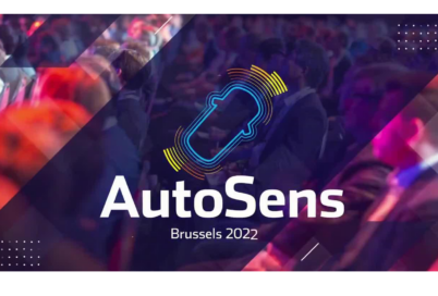 Colorful poster with a figure of an automobile and the phrase "AutoSens Brussels 2022" overlapping