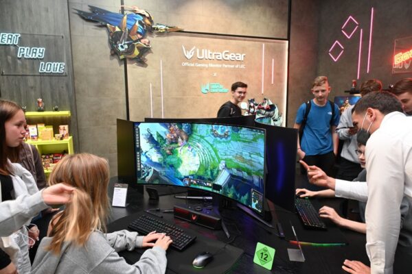 Part of the LG Booth at IFA 2022 where visitors are playing games on LG UltraGear Gaming monitors