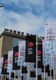 Close-up view of Messe Berlin where promotional flags of LG logo and Busan's bid for World Expo 2030 were flying in front