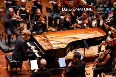 Pianist Jan Lisiecki performing with an orchestra at the Kurhaus Wiesbaden convention center for a charity concert LG SIGNATURE hosted.