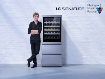 Pianist Jan Lisiecki posing next to LG SIGNATURE Wine Cellar