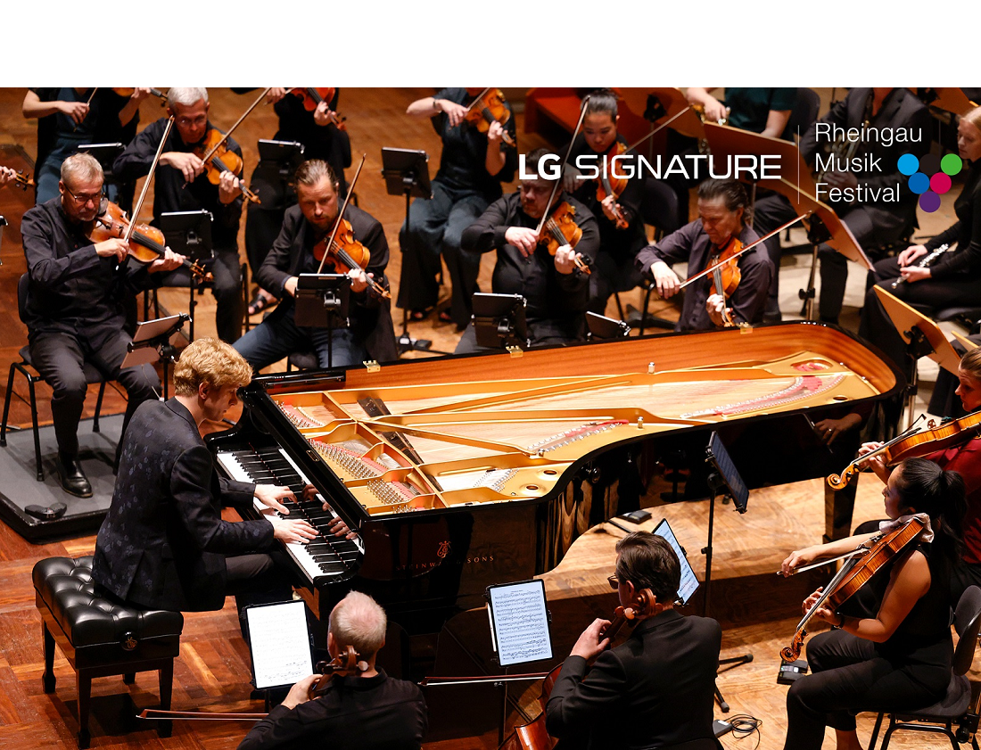 Pianist Jan Lisiecki performing with an orchestra at the Kurhaus Wiesbaden convention center for a charity concert LG SIGNATURE hosted.