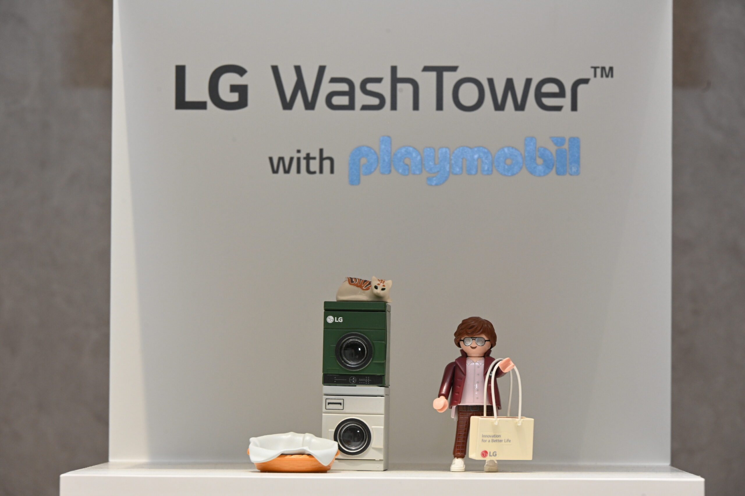 Miniature-scale of LG WashTowerTM and character figures by LG and PLAYMOBIL collection
