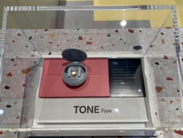 Close shot of the LG TONE Free earbuds (model T90) displayed under glass at LG's booth at IFA 2022.