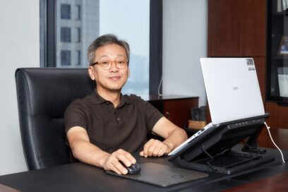 Lee Sam-soo, Chief Digital Officer at LG Electronics, posing at his office with LG gram