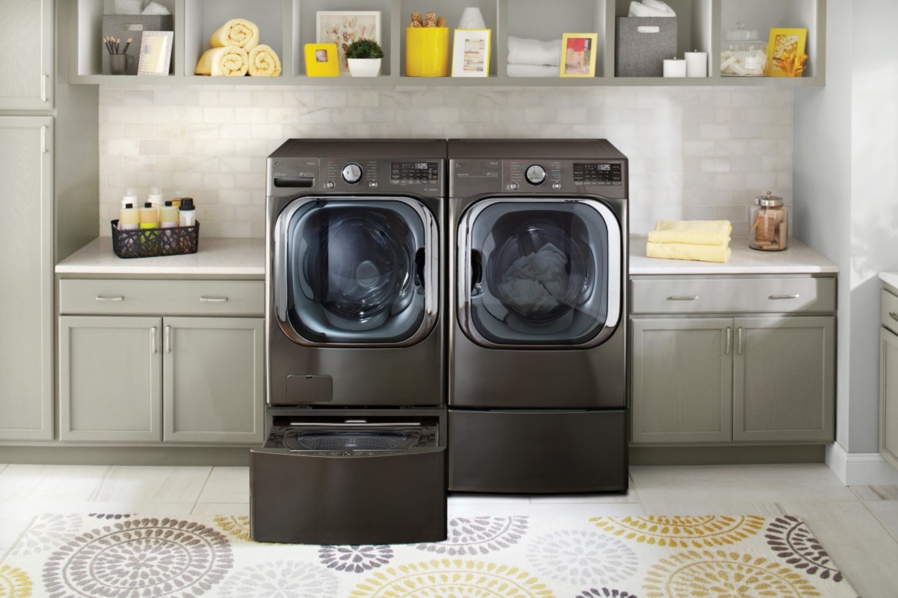 The LG TWINWash pictured in a home, with the LG SideKick washer below opened.