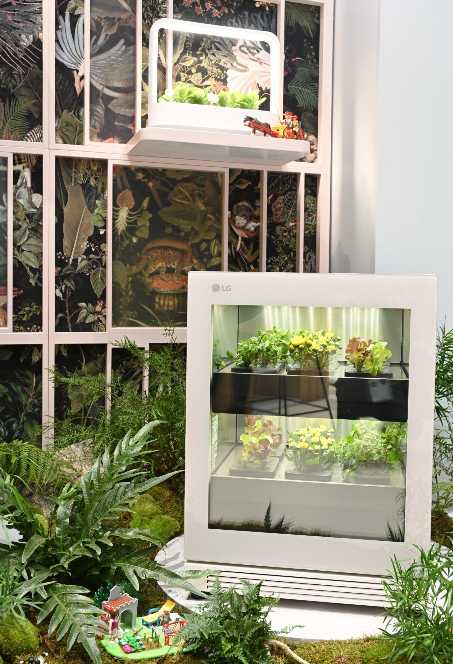 LG tiiun and tiiun mini are placed on the floor and wall shelf respectively, growing plants