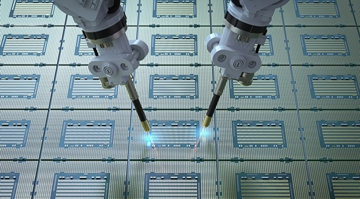 Semiconductors being fabricated by two robots 