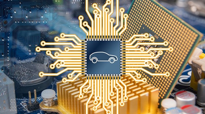 Semiconductor with a shape of a car engraved and having a picture of a production site on the background