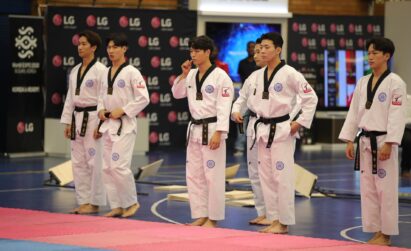 Taekwondo athletes preparing for a performance at the Ambassador's Taekwondo Cup in South Africa