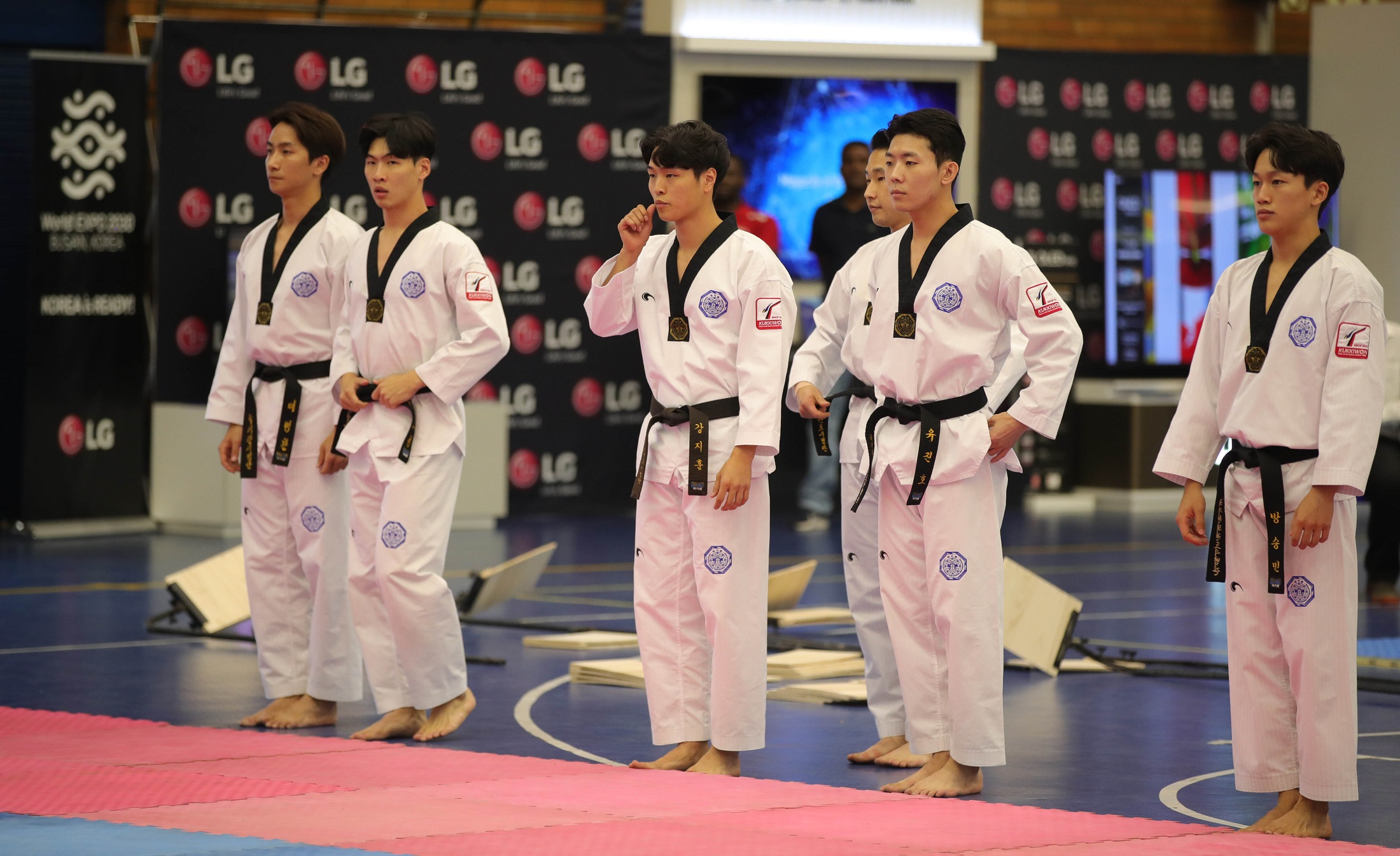 Taekwondo athletes preparing for a performance at the Ambassador's Taekwondo Cup in South Africa
