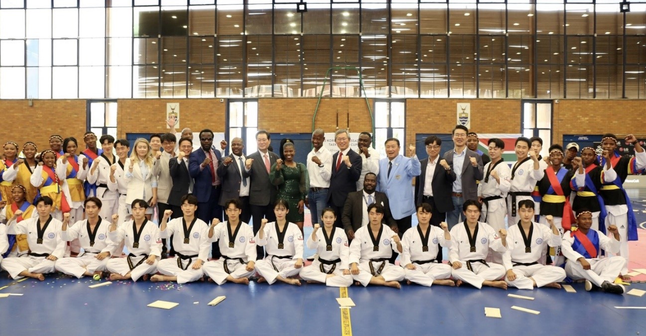 Participants of the Ambassador's Taekwondo Cup in South Africa posing for a picture together
