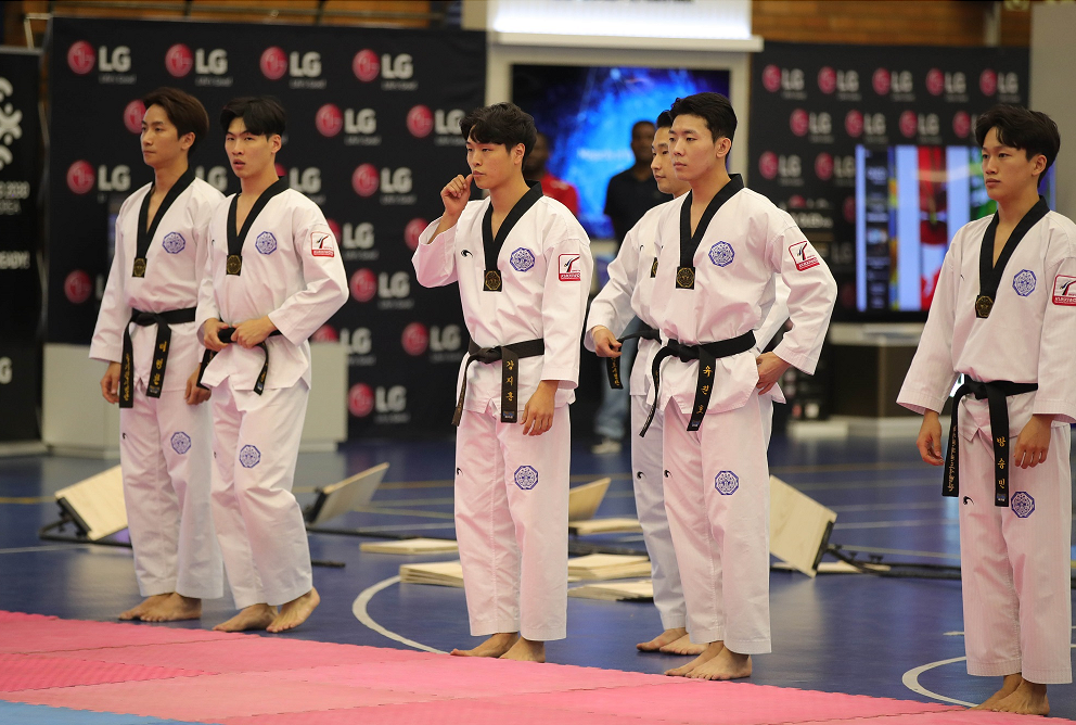 Taekwondo athletes preparing for a performance at the Ambassador's Taekwondo Cup in South Africa