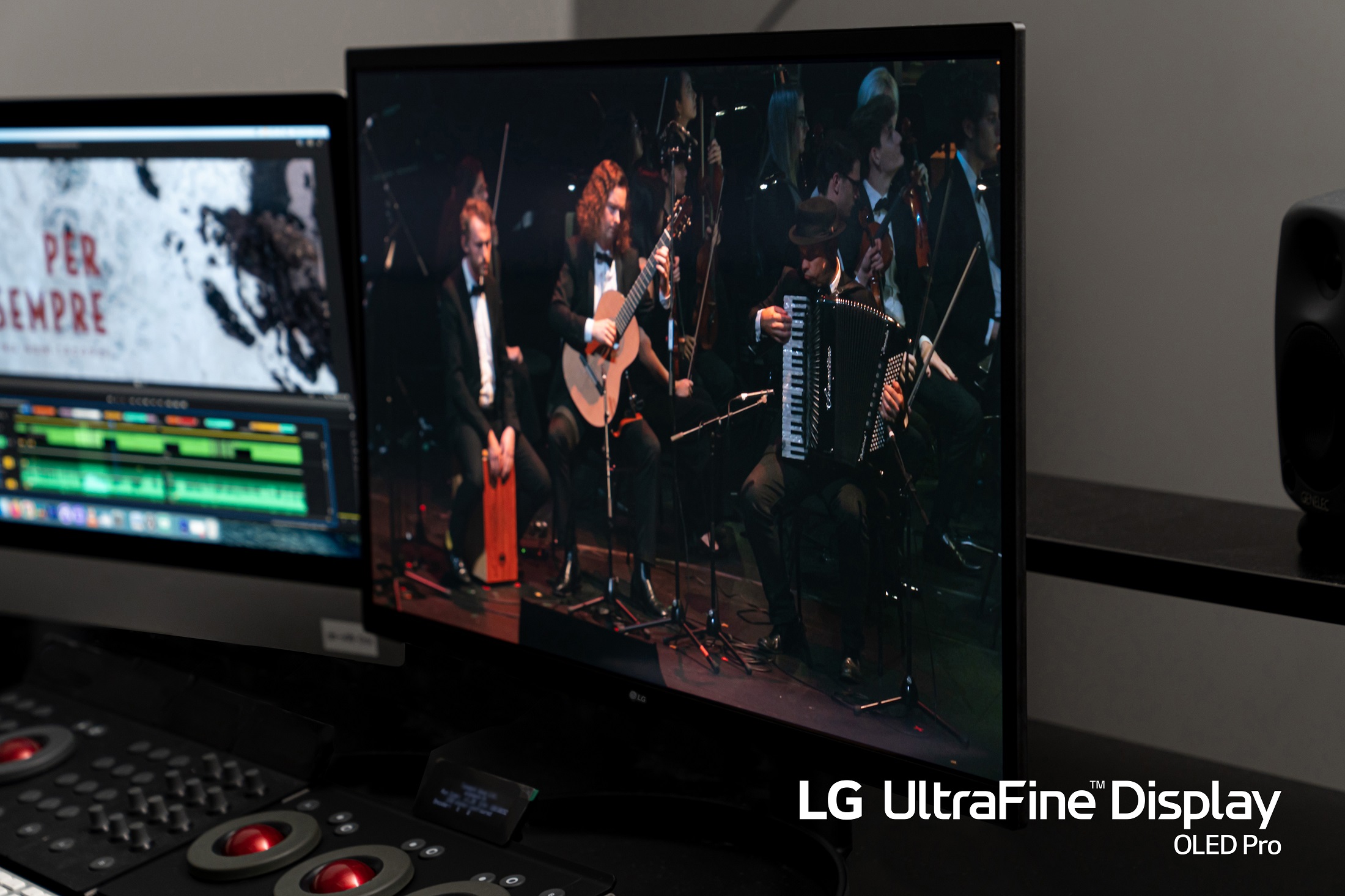 A closeup photo of LG UltraFine Display OLED Pro displaying an orchestra during its performance