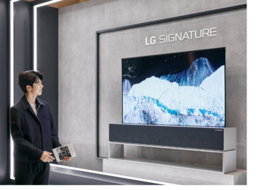 Professional ice skater Cha Jun-hwan admiring the LG SIGNATURE OLED R TV on display in the LG SIGNATURE Hall lobby