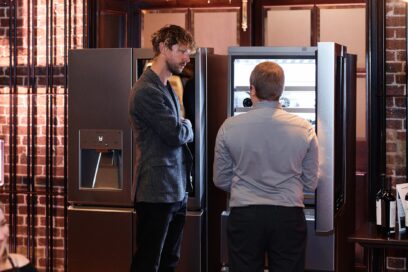 Two men conversing in front of LG SIGNATURE InstaView Door-in-Door Refrigerator and Wine Cellar