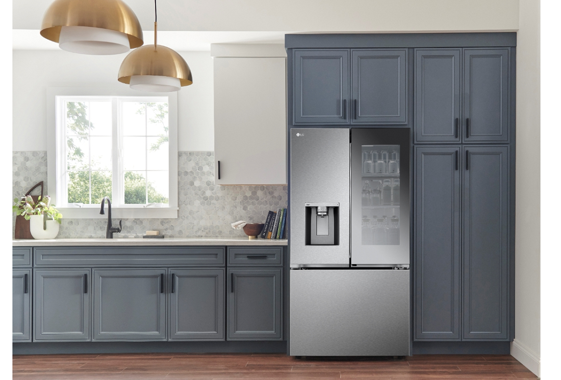 LG’s new InstaView™ French-Door refrigerator installed in the kitchen between the built-in drawers.