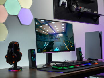 An image of full desk setup including 27GR95QE and other gaming gears