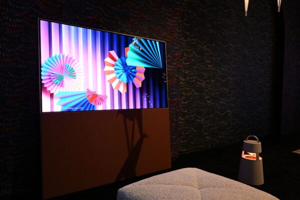 LG OLED Objet Collection Easel and LG XBOOM speaker featured in a living room showroom at CES 2023