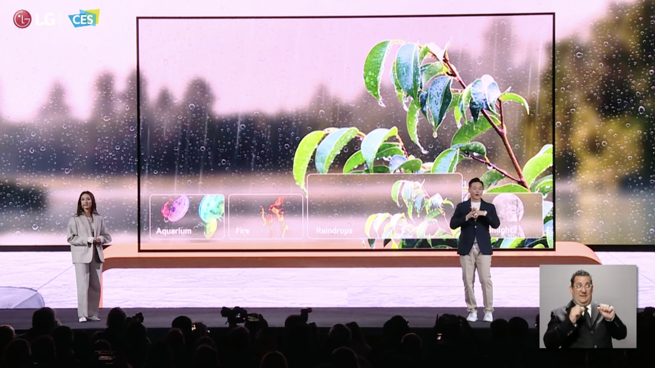 A livestreaming of LG's press conference at CES 2023, where two people are introducing LG OLED T for the first time. There is a small screen on the right bottom corner where Edward Tory Jarmailo, a sign language interpreter, is providing ASL interpretation for the event