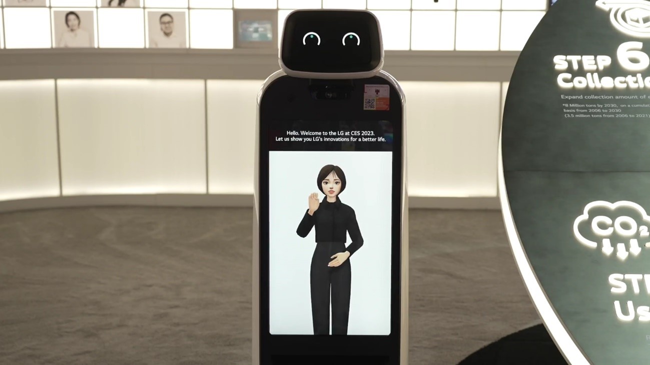 A closeup photo of LG CLOi GuideBot at the LG Better Life for All zone at CES 2023 displaying Reah Keem on screen