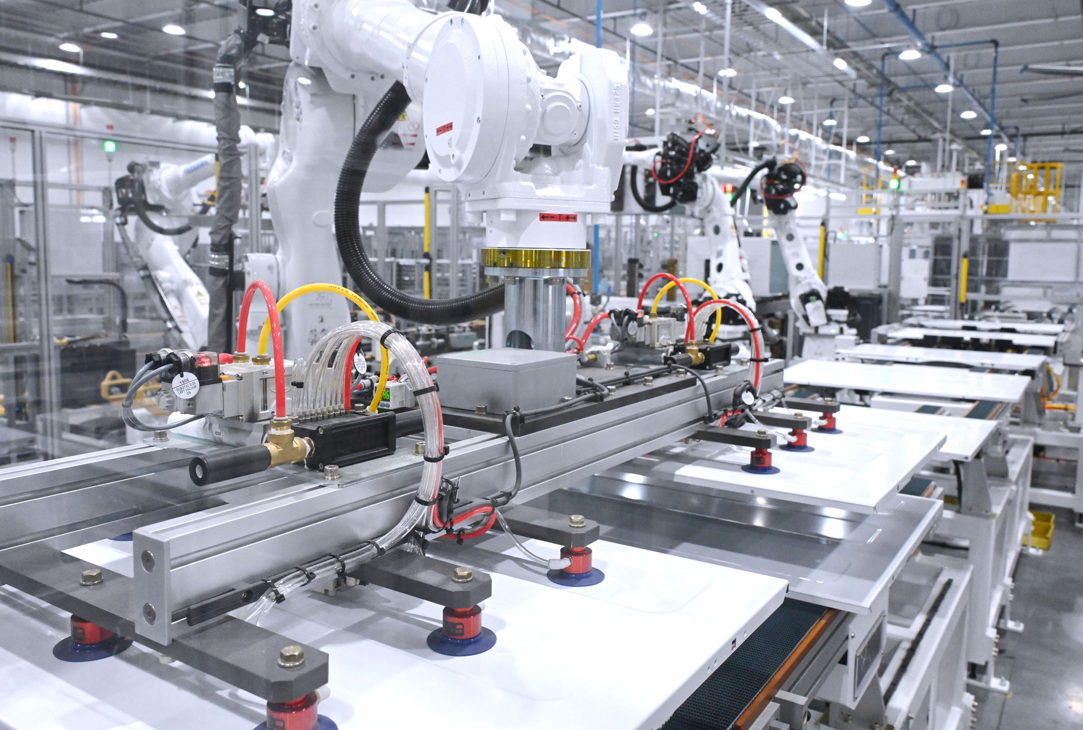 In the LG Tennessee factory, the robots are lifting heavy parts