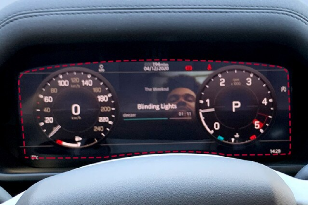 A closeup photo of a cluster screen installed on a vehicle