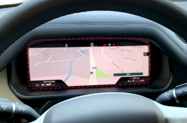 A closeup photo of a cluster screen displaying navigation