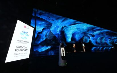 A photo of LG OLED Horizon and a display panel with a promotional phrase regarding World Expo 2030 at CES 2023