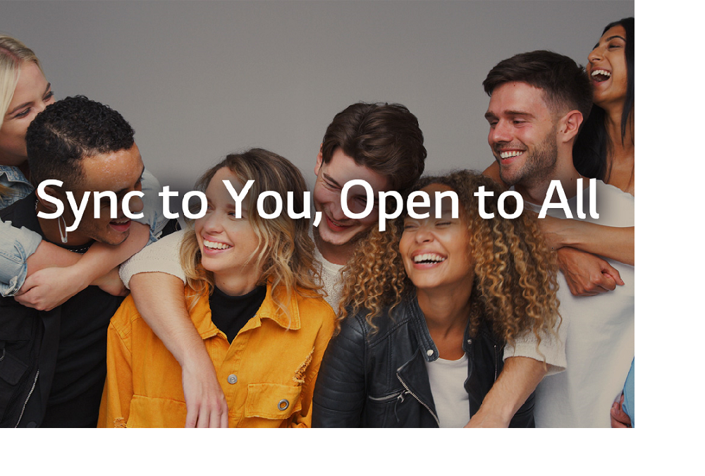 LG’s new vision statement, “Sync to You, Open to All,” overlaying a group of friends smiling