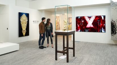 A man and a woman observing the Barry X Ball artwork displayed on an LG OLED TV at the LG OLED Art project exhibition