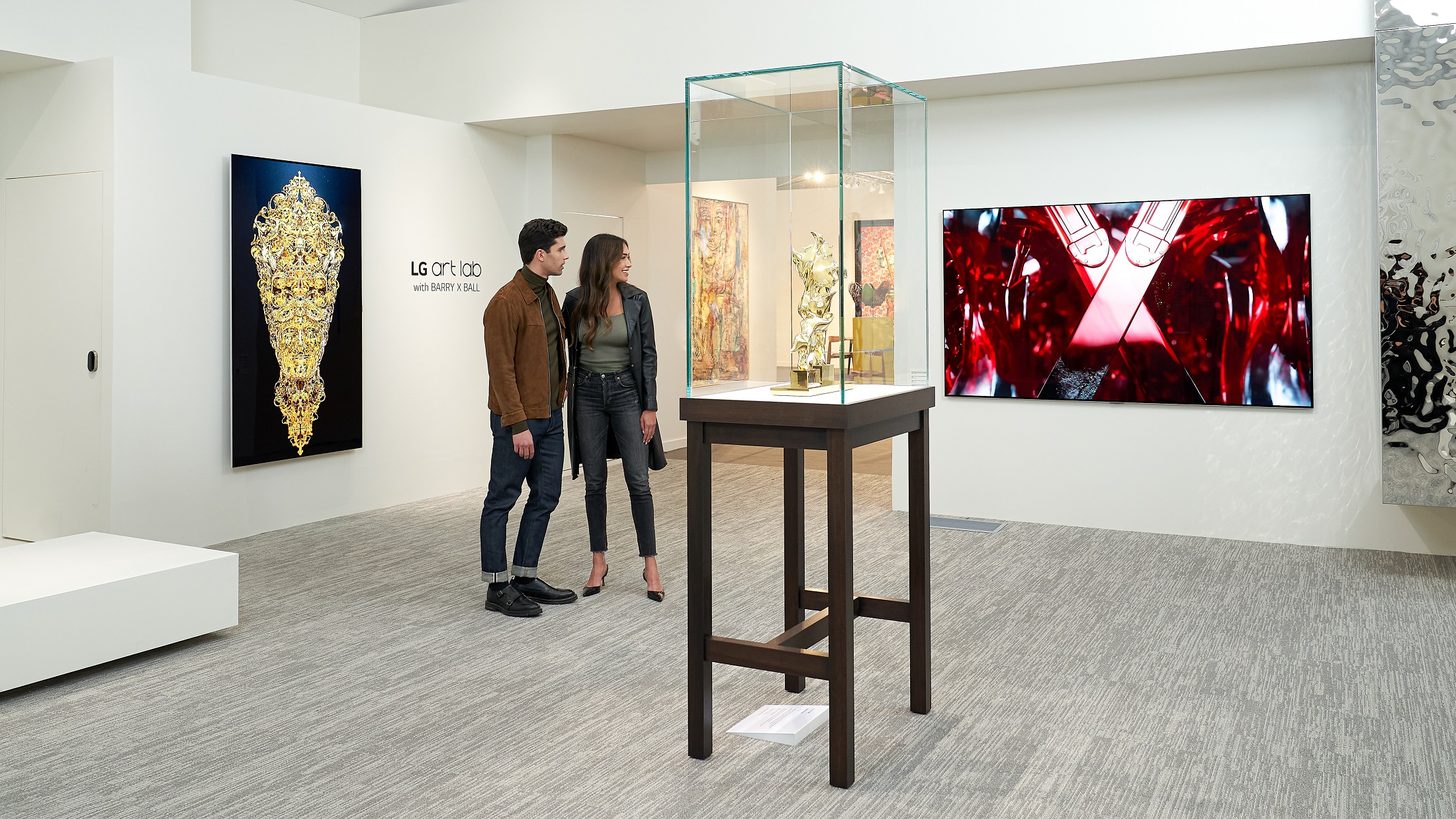 A man and a woman observing the Barry X Ball artwork displayed on an LG OLED TV at the LG OLED Art project exhibition