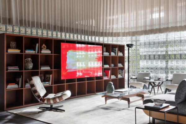 The bedroom of LG Magenta House at CASACOR decorated with LG TV displaying a colorful image