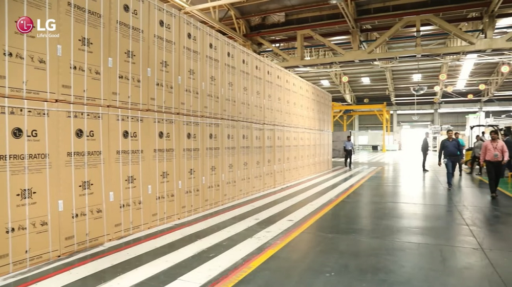 A large number of LG side-by-side refrigerators stored inside the India Pune manufacturing facility.