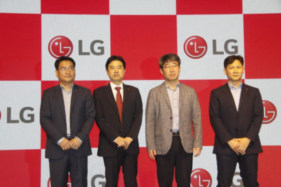 LG executives Ji Hyoung-sub, Jeon Hong-ju, Lee Hyun-uk and Kim Jae-il posing for a group photo in front of LG logos.