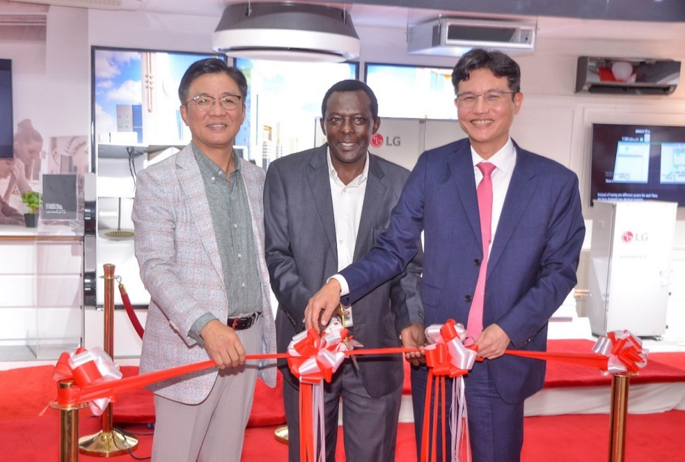 Kim Yong, Kim Sa-nyoung and Dr. Reuben Kivindu cutting the ribbon at LG East Africa’s HVAC showroom.