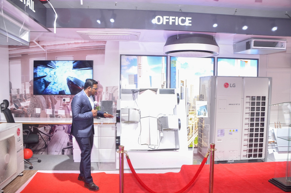 Raja Durai demonstrating LG’s air solution technology at LG East Africa’s HVAC showroom.