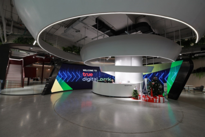 The information desk at True Digital Park West surrounded by a curved LG signage display.