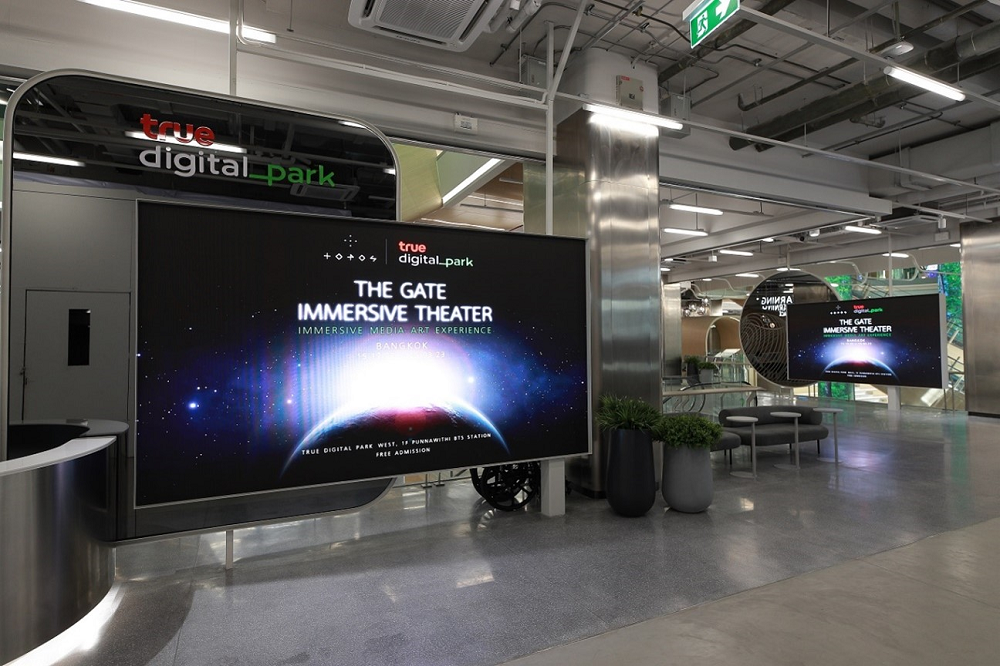 An LG screen displaying the words “The Gate Immersive Theater” at True Digital Park West.