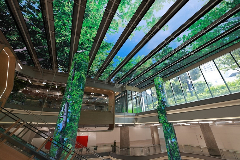 A third view of LG’s LED signage expressing images of a forest on the ceiling and pillars of Bangkok’s True Digital Park West.