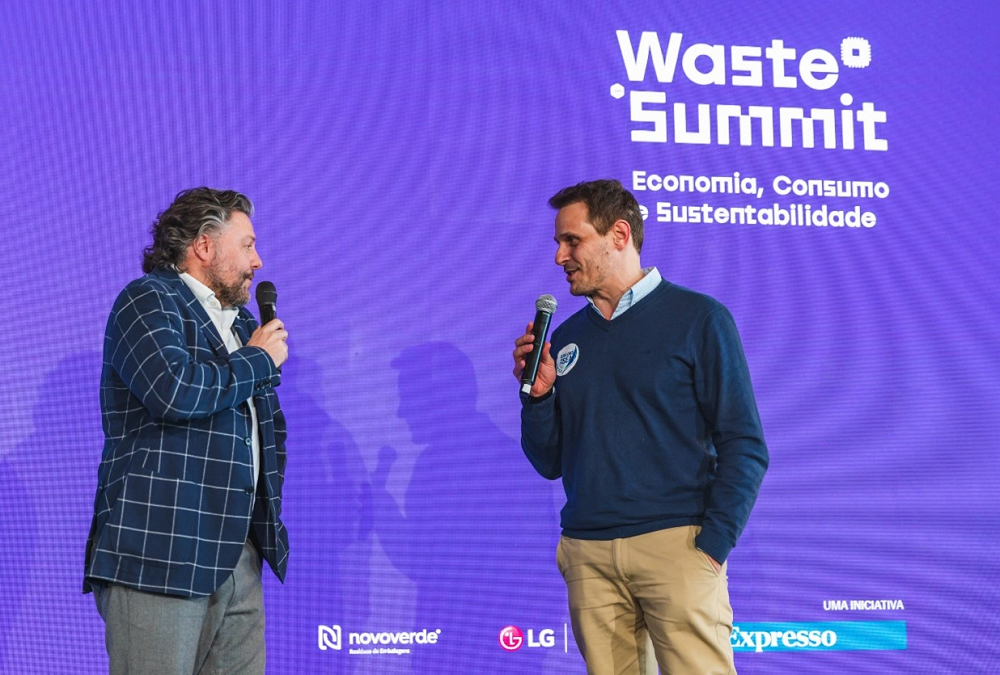 Comedian César Mourão and Isaac Silveira, vice president of Sailors for the Sea, talking on stage at the Waste Summit.