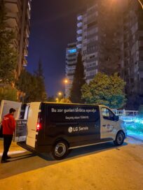 Photo of a LG employee taking out LG NanoCell TV from a vehicle