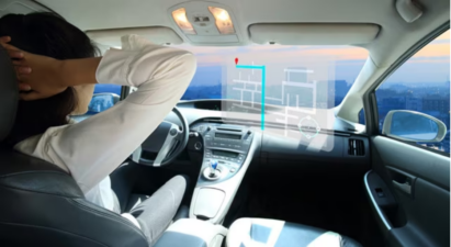 A driver looking at the hologram map