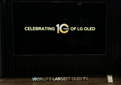 The world’s largest OLED TV mounted on a wall and displaying the phrase ‘Celebrating 10 years of LG OLED’ at the 2023 showcase event.