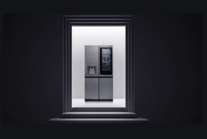 View of LG SIGNATURE InstaView Door-in-Door Refrigerator through a door frame.