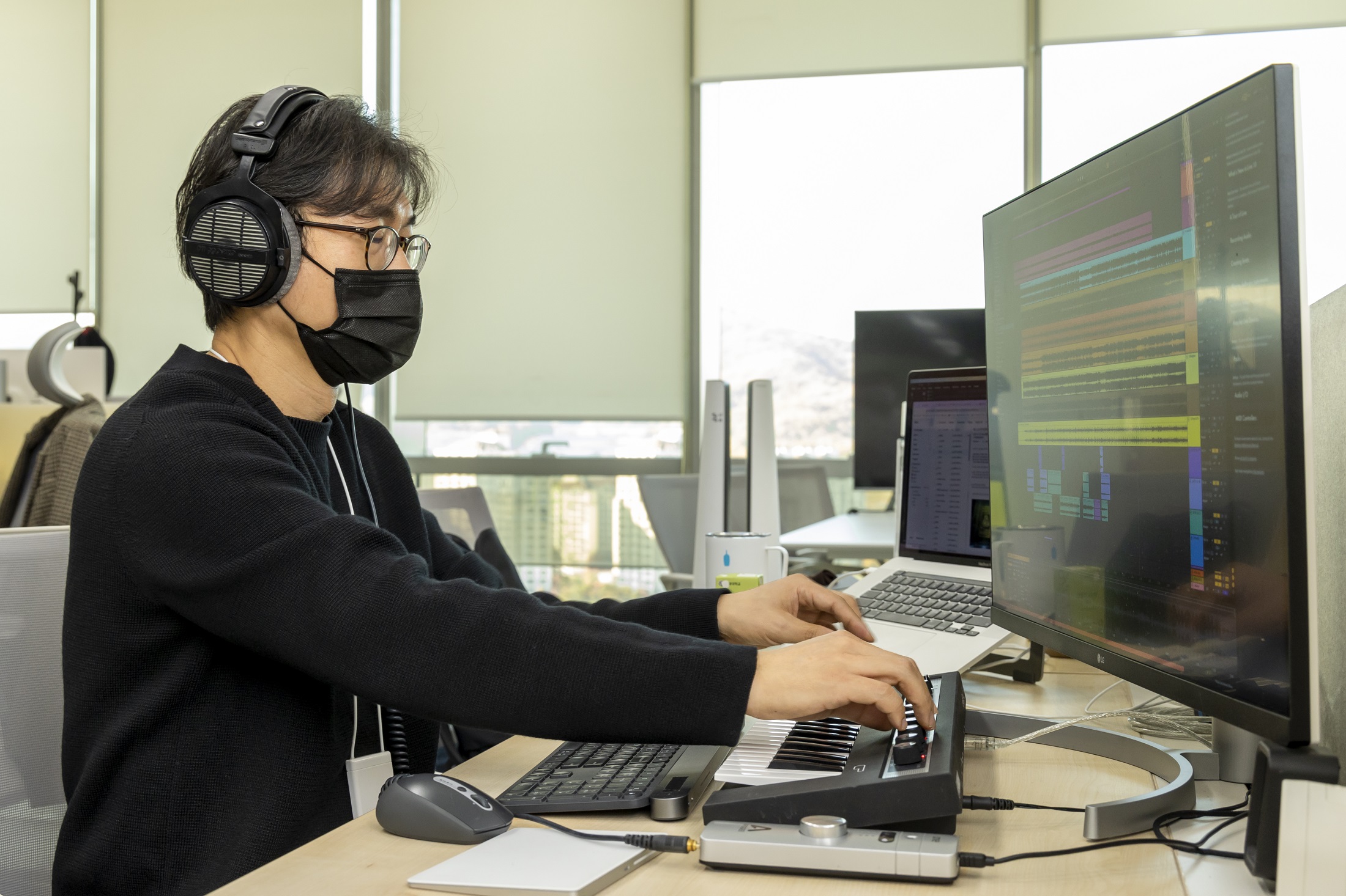 Jeong Byoung-zoo, senior sound designer at LG UX Governance Team, using a synthesizer