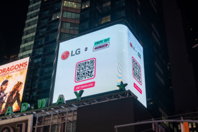A close-up photo of a billboard in Times Square, New York displaying a collaboration of LG with Swipe Out Hunger and a QR code