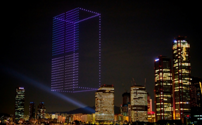 A photo of the LG MoodUP refrigerator made out of 1,000 drones brightening the night sky above Seoul, Korea